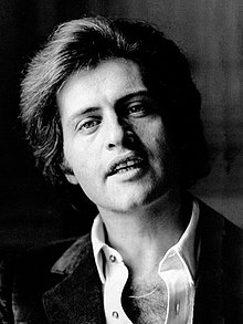 black and white headshot photo of Joe Dassin, the singer of Dans les yeux d