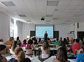 Woman giving a workshop in a classroom