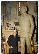 Gilbert A. Franklin posing with Truman statue (c. 1975)