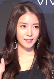 BoA with brown hair facing towards the camera