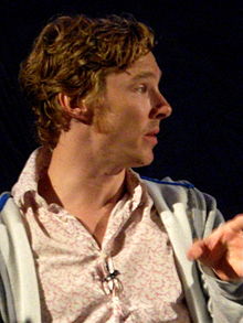 Benedict Cumberbatch facing right with brown-reddish hair