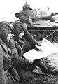 Image 45Soldiers in an East German tank unit reading about the erection of the Berlin Wall in 1961 in Neues Deutschland (from Newspaper)