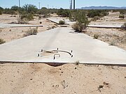 Manhole cover of the first Corona Satellite Calibration Target with a cement cover and rebar handles.