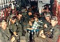 Blueboy assault group aboard HH-3E at the start of the mission. CPT Richard Meadows is seated in the left foreground.[99][100][n 55]