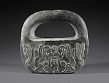 A chlorite object with the Master of Animals motif from Kerman's Jiroft culture, dating back to Bronze Age I, kept at the Museum of Ancient Iran.
