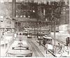 Roller coasters of Palisades Amusement Park are visible above the trolley terminal in Edgewater, New Jersey in the early 20th century