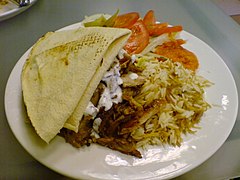 Mixed shawarma with rice and tomatoes