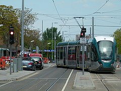 Tram exiting the reversing siding; the stop is hidden by the tram