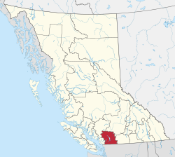 A map of British Columbia depicting its 29 regional districts and equivalent municipalities. One is highlighted in red.