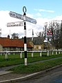 Signpost near School in centre of Hovingham