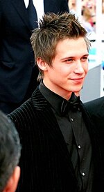 A photo of a young man with short light brown hair.