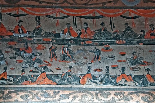 An ancient mural painting of a late Eastern-Han period (Simplified Chinese: 东汉; Traditional Chinese: 東漢; Pinyin: Dōng Hàn) Chinese tomb showing lively scenes of a banquet (yanyin 宴饮), dance and music (wuyue 舞乐), acrobatics (baixi 百戏), and wrestling (xiangbu 相扑). From the tomb of Dahuting (Chinese: 打虎亭汉墓, Pinyin: Dahuting Han mu; Wade-Giles: Tahut'ing Han mu), on the southern bank of the Suihe River in Zhengzhou, Henan province, China (six kilometers west of Xi County, Henan). Excavations of the tomb were carried out in 1960-1961.