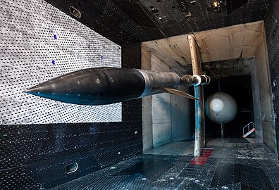 The AGARD model in the B configuration is installed in the 16-foot transonic wind tunnel