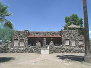 The Fisher Memorial Home was built in 1927 and is located at 300 E. 8th St. The combination house/funeral home was built in 1927. It was listed in the National Register of Historic Places in 1985, reference #85000884.