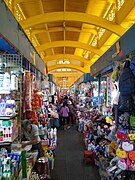 A walkway lined with shops in 2020