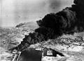 Image 27Smoke rises from oil tanks beside the Suez Canal hit during the initial Anglo-French assault on Egypt, 5 November 1956. (from Egypt)