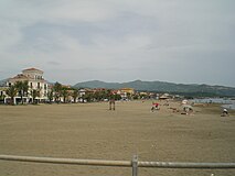 View of the beach of Marina di Casalvelino with the hills of Ascea in background