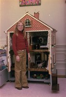 Amy Carter pictured in the White House with an American dollhouse, 1978