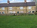 Former miners' and steelworkers' cottages by the village green