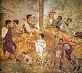 Image 66A multigenerational banquet depicted on a wall painting from Pompeii (1st century AD) (from Roman Empire)