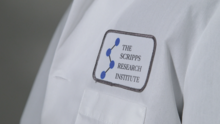 A lab coat with a The Scripps Research Institute patch