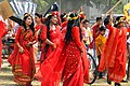 Girls in Bangladesh wearing traditional saris and flower crowns at Pohela Boishakh celebration in Chittagong