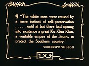 Silent film text card, reading "The white men were roused by a mere instinct of self-preservation... until at last there had sprung into existence a great Ku Klux Klan, a veritable empire of the South, to protect the Southern country"