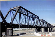 The Southern Pacific Railroad Bridge over Tempe Lake was built in 1912. Listed in the National Register of Historic Places in 1985 as the Salt River Southern Pacific RR Bridge, reference #85003546.