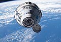 The Boeing CST-100 Starliner spacecraft in the process of docking to the International Space Station