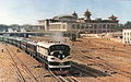 An NY1 diesel locomotive hauling a passenger train out of the Beijing railway station in 1959