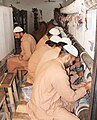 Convicted prisoners busy in knitting Persian designs' carpets in the carpet industry of the jail in 2010