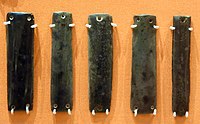 Obsidian jewelry. It is unknown whether they were sewn to clothing or they were joined together to make a necklace, bangle, or belt. 6000-5000 BC
