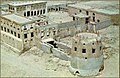 An aerial view of the façade of Darin Castle, behind which the palace of Muhammad bin Abdul Wahhab al-Faihani is visible.