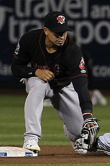 A baseball player in black and gray