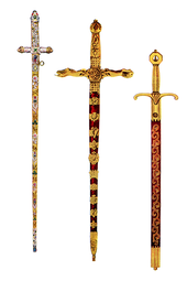 Three highly ornate swords, side by side. Two have gold handles and decoration on red velvet scabbards. The one on the left is paler and covered in jewels.