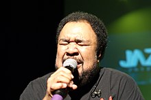 Duke sings on stage in 2010