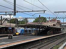 A HCMT on a Cranbourne-bound service can be seen passing Platform 4. Taken from Platform 1, looking south-east, taken in October 2023