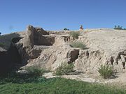 The Mesa Grande Temple Mound is located in the Mesa Grande Cultural Park at 1000 N. Date St. Built by the Hohokam in 1100 AD. The walls are made of “caliche”, the calcium carbonate hardpan that forms under the desert soils. The mound is longer and wider than a modern football field (note: U.S. Football) and is 27 feet high. The Mesa Grande Cultural Park was listed in the National Register of Historic Places in November 21, 1978, reference number 78000549.