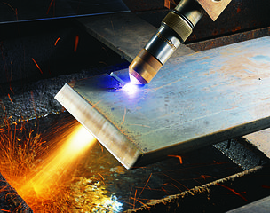 Close up of a Hypertherm HyPerformance plasma torch cutting metal