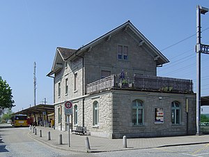 Two-story stone station building with gabled roof
