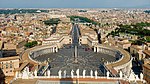 Large circular square with columned buildings and an obelisk in the middle.