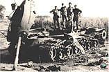 Officers of the Indian Army on a destroyed Pakistani tank during.