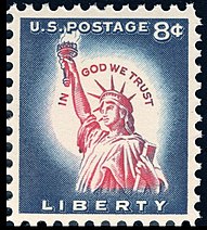 8¢ postage stamp from 1954, with the motto inscribed around the Statue of Liberty's head, in the white area surrounding her head. At the time, eight cents was the standard rate for international postage. A 3¢ (domestic mail rate) stamp with a similar design was also issued.
