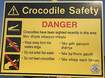 Crocodile Safety. Danger. Crocodiles have been sighted recently in this area. Bäru dhiyala wäŋaŋura nhäŋala. Keep away from the waters edge. Yaka galki gapuŋura dhärriya. Do not enter the water. Yaka ḻup'thurra gapulili. Do not feed crocodiles. Yaka wikaŋa wayin bäruwu.