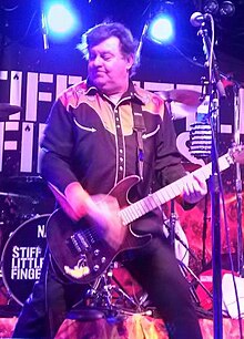 Burns, performing with Stiff Little Fingers in 2019