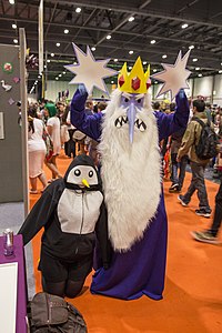 Person dressed as Ice King stands next to person dressed as Gunter the penguin