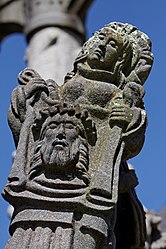 St Veronica holds up her veil bearing Jesus' image.