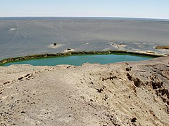 A green lake within a depression