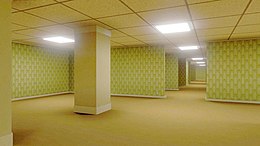 An image of the Backrooms. A large, open room with carpet, fluorescent lights and yellow wallpaper. A gap in the wall shows similar rooms continuing endlessly.