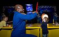 Melvin, center, blasts off a rocket for young participants at a 'Build the Future' event sponsored by LEGO at the Kennedy Space Center Visitor's Complex.